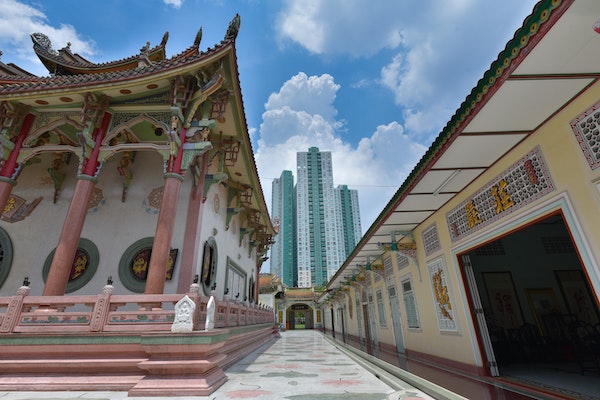 temple juxtaposed against modern building